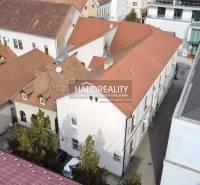 Commercial premises in Rimavská Sobota with red roofs from a bird's eye view.