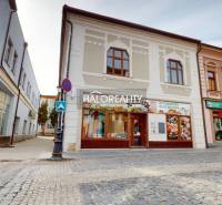Commercial premises in Rimavská Sobota with an ancient facade and stone paving.
