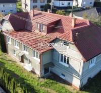 A family house in Hrachovo with a red roof and a picturesque garden in a quiet location.