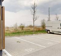 Parking lot on Hany Ponická Street in Bratislava - Lamač with a van and passenger cars.