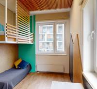 Children's room with elevated seating, wooden decor flooring, 4-room apartment.