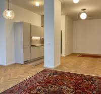 Interior of a 2-room apartment with a wooden decor floor and carpets.