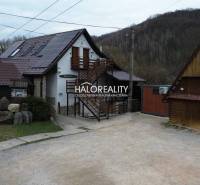 Gastro premises in Hnúšťa with parking and buildings in a natural environment.