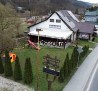 Restaurant gastro premises in Hnúšťa with a playground and surrounding greenery by the road.