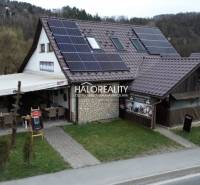 A restaurant in Hnúšťa with photovoltaic panels offers pleasant dining spaces.