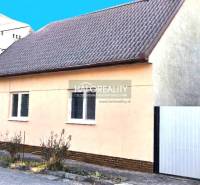 A family house in Lučenec with a simple facade and a sloped roof.