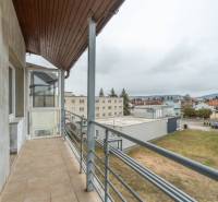 The balcony of a 4-room apartment in Poprad with a view of the urban landscape.