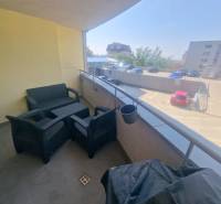 Balcony of a 2-room apartment on Majerníková Street in Bratislava – Karlova Ves with outdoor seating.