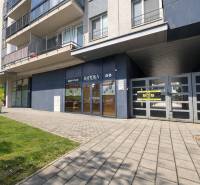 Commercial premises on Hrachova Street in Bratislava - Ružinov, a modern building with green surroundings.