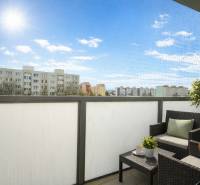 The balcony of a one-room apartment on Golianova Street in Trnava with comfortable seating and a view.