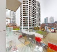 View from the balcony of modern buildings and the city in Bratislava on Bottova Street.
