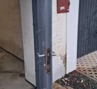 Open metal gate in the garages on Prachatická Street in Zvolen.