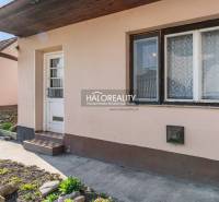 Entrance to a family house in Horná Potôň with a small garden and a pathway.