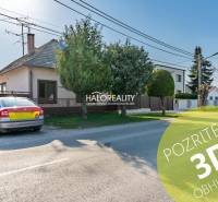 A family house in Horná Potôň with a parking lot and a well-maintained garden by the road.