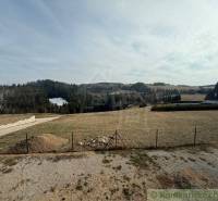 A picturesque landscape near a family house in Lom nad Rimavicou, with distant forests and meadows.