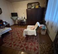 Living room in a family house with a carpet and flooring with a wood decor.