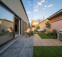 A terrace of a family house in Poprad with a hot tub, grill, and green lawn.