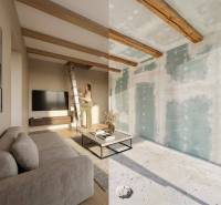 A family house with a wooden decor floor, a sofa, a television, and a decorative table.
