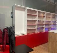 Commercial space with glass showcases and a hanger, floor with wood decor.