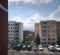 A view of apartment buildings and a parking lot on Mozartova Street in Bratislava - Old Town.
