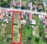 Aerial view of a plot in Rumanová suitable for living, surrounded by houses.