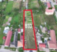 Plots - housing in Rumanová, marked rectangle, surrounded by family houses.