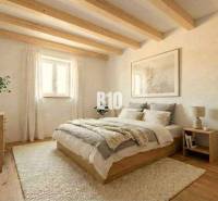 Interior of a cabin with wooden beams, a comfortable bed, and a floor with a wooden decor.