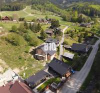 A view of picturesque family houses in the mountainous environment of Horná Mariková.