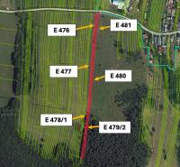 Orthophotomap showing parcel plots and a narrow road in the agricultural and forest lands of Veľká Čausa.