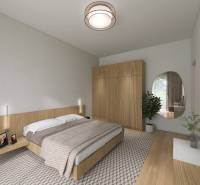A bedroom in a family house with a double bed, a wardrobe, and a wooden decor floor.