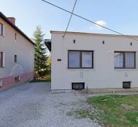 A family house on Mládeže Street in Dolný Hričov with a pebble courtyard and a front garden.
