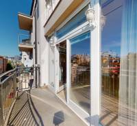 A balcony on an apartment building on Lazaretská Street in Bratislava, with a view of the surroundings.