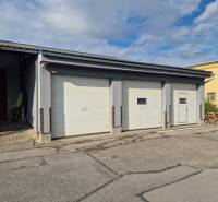 Industrial buildings in Žilina, warehouse and halls with three rolling gates.