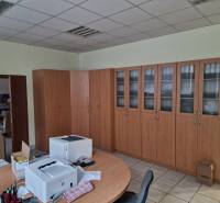 Office spaces with wooden floor decor and office equipment in warehouses and halls.