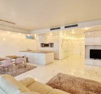 Spacious living area in a 3-room apartment with a dining area and a modern kitchen.