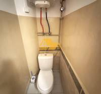 A toilet with a boiler in a 2-room apartment.