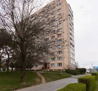 An apartment building surrounded by trees and a hedge on Štítová Street in Košice, Staré Mesto district.