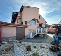 A family house in Dvorníky with a terrace, garden, and garage in the yard.