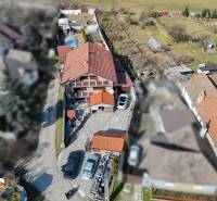 A family house in Dvorníky with a large yard and a pool on the property.