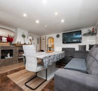 Living room in a family house with a comfortable sofa and a wooden decor floor.