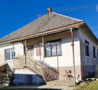 A family house in Malá Lehota with a pitched roof, staircase, and garden.