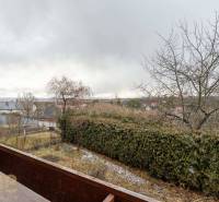 View from a 5 or more room apartment in Stará Lesná to the garden and surrounding houses.