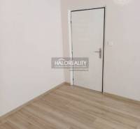Bathroom in a 3-room apartment with a sink, toilet, and floor with a wooden decor.