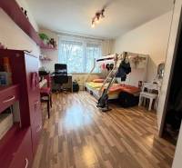 Children's room with a cabinet, bunk bed, and floor with wooden decor in a 3-room apartment.