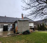 A family house on Hlavná Street in Piskorovce with a spacious yard and nature in the background.