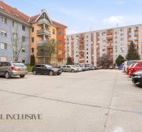 Parked cars in front of apartment buildings in Nova Ves, Dunajská Streda.