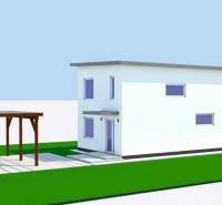 A family house in Michalovce with a white facade and a shelter, green grassy areas.