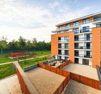 A new building on Cedar Street in Košická Nová Ves with a park environment and a terrace.