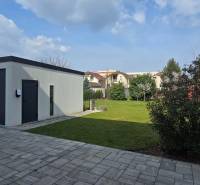 Garage and green yard in Trnava on Gábora Steinera Street near a 3-room apartment.
