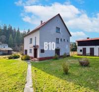 A family house in Raková with a large plot, surrounded by nature and pine trees.